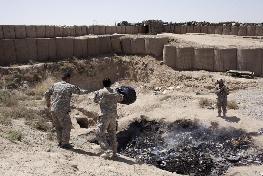 Soldiers at the side of infamous burn pits