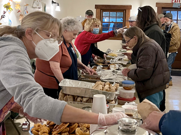 Uncle Foods Servers People serving food buffet style
