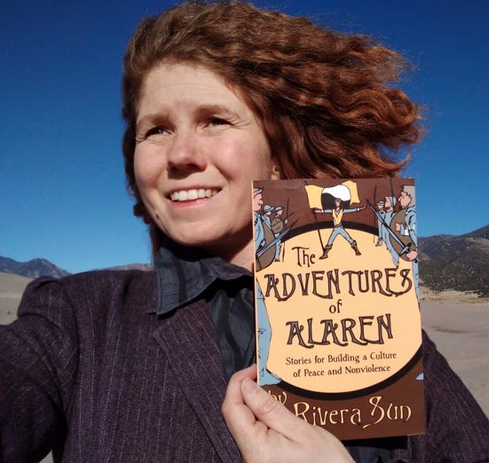 Rivera Sun holding book "Adventures of Alren"